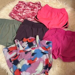 5 pairs of girls athletic shorts and 1 romper size 6. Used- great condition.